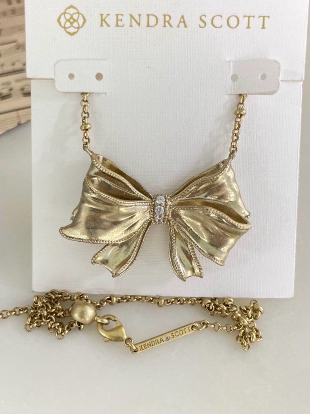 Kendra Scott Gold Bow Necklace with Crystal Center